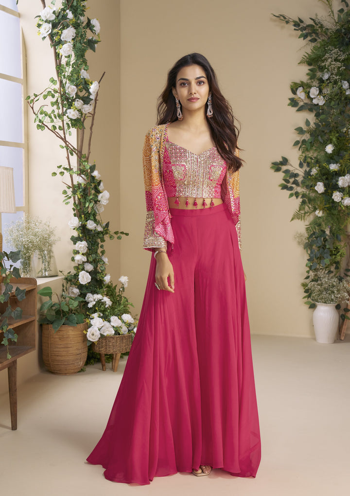 Woman in a pink festive bandhej print indo western outfit 