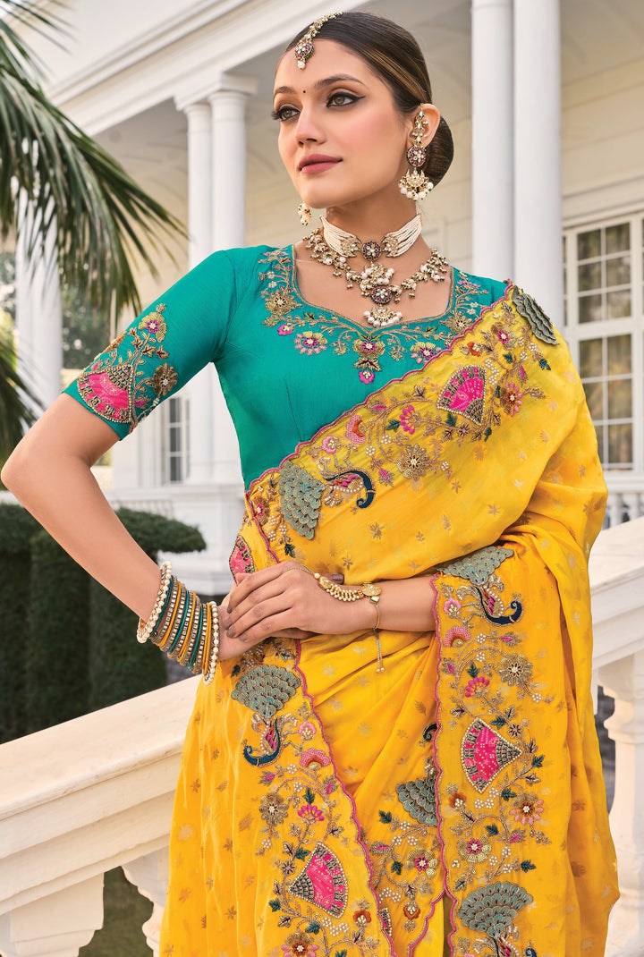 bridal wear traditional yellow saree with blue choli